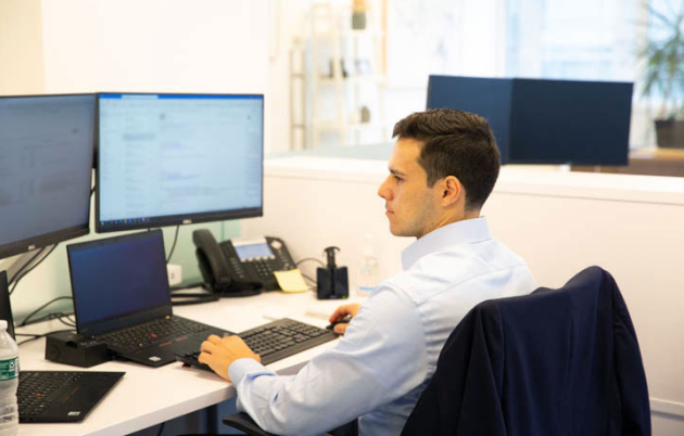 level team member working at desk